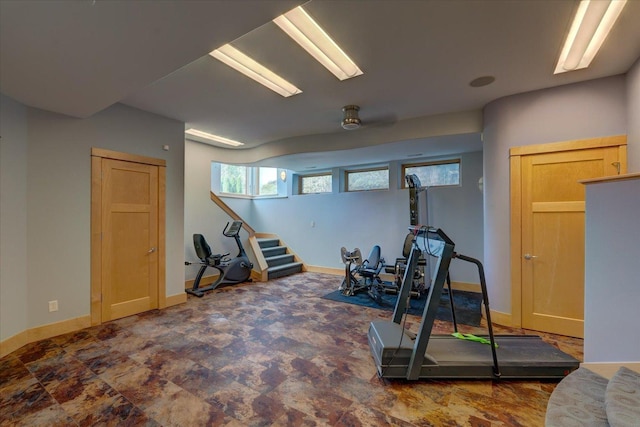 workout area featuring baseboards