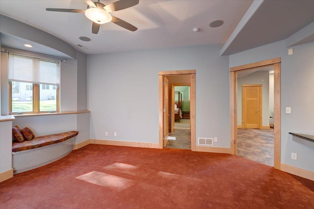 unfurnished bedroom featuring carpet, visible vents, and baseboards