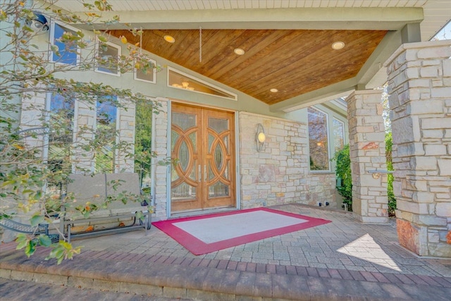 view of exterior entry with stone siding