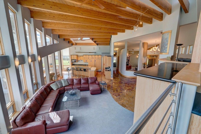 living room featuring a chandelier and beam ceiling