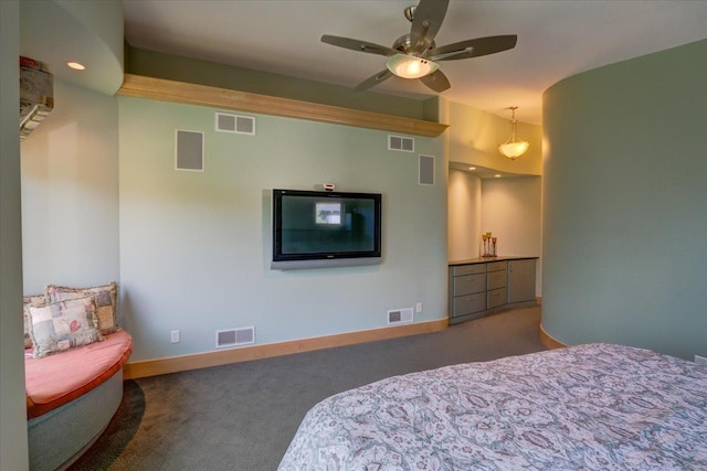 bedroom with dark carpet and visible vents