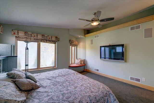 bedroom featuring freestanding refrigerator and visible vents