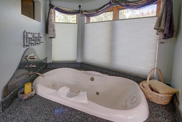 full bathroom featuring a whirlpool tub