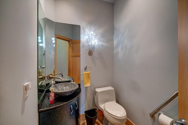 half bath with vanity and toilet