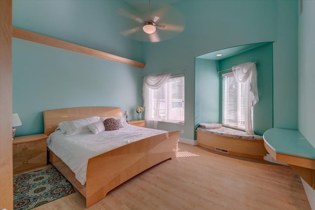 bedroom with ceiling fan and light wood-type flooring