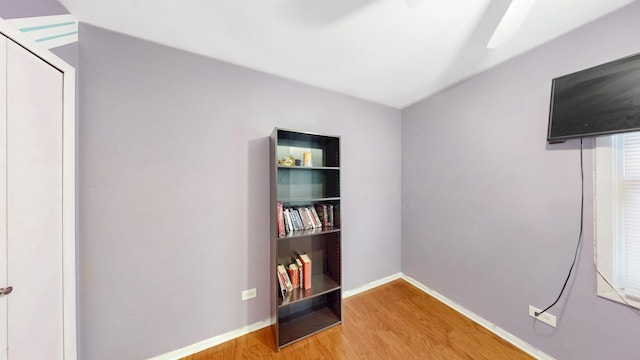 interior space featuring light wood-style flooring and baseboards