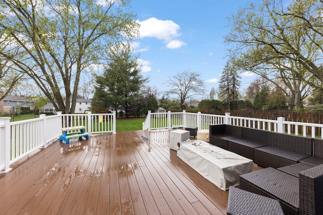 wooden terrace with an outdoor hangout area