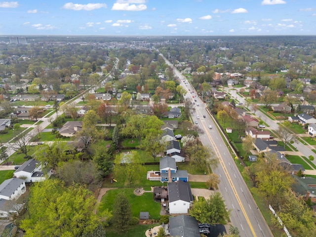 birds eye view of property with a residential view