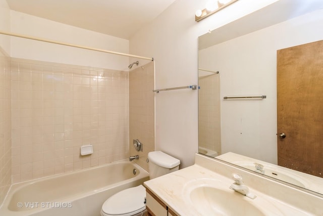 bathroom featuring vanity, shower / tub combination, and toilet