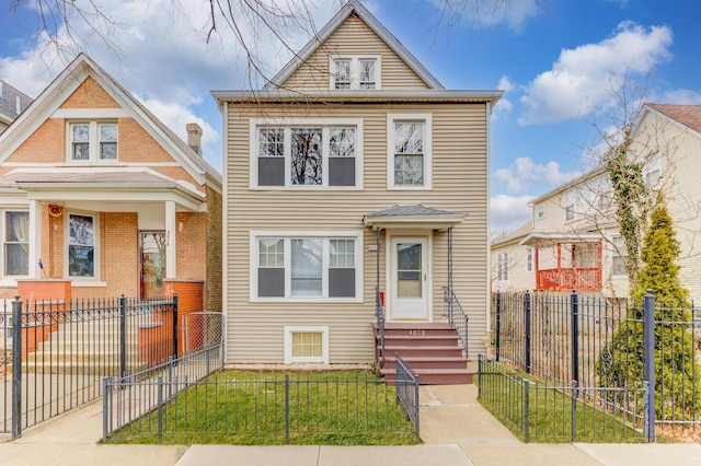 view of front of home featuring a fenced front yard, entry steps, and a front yard