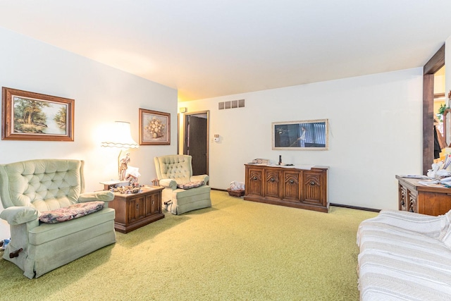 living room featuring baseboards, visible vents, and light colored carpet