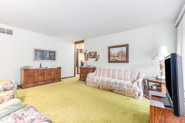 living area with carpet and visible vents