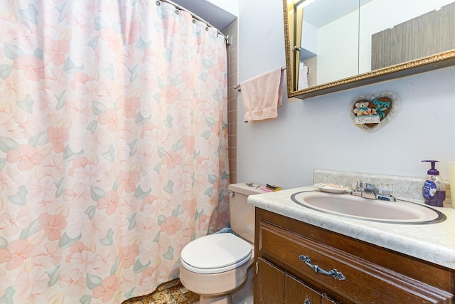 bathroom with toilet and vanity