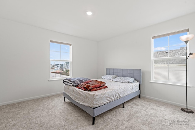 bedroom with carpet floors and baseboards