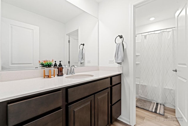 bathroom featuring vanity and wood finished floors