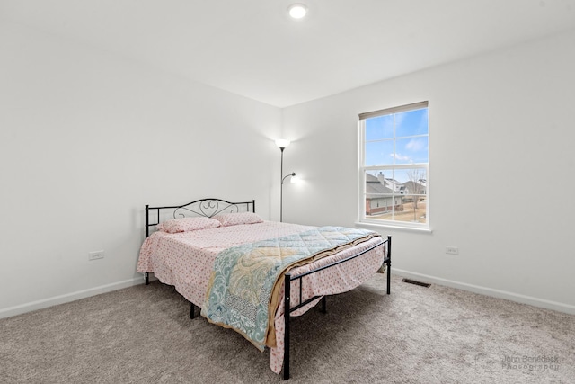 bedroom featuring carpet, visible vents, and baseboards