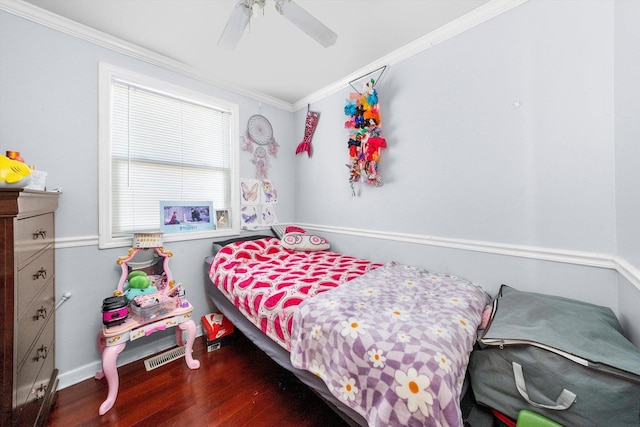 bedroom featuring ceiling fan, dark wood-style flooring, and crown molding