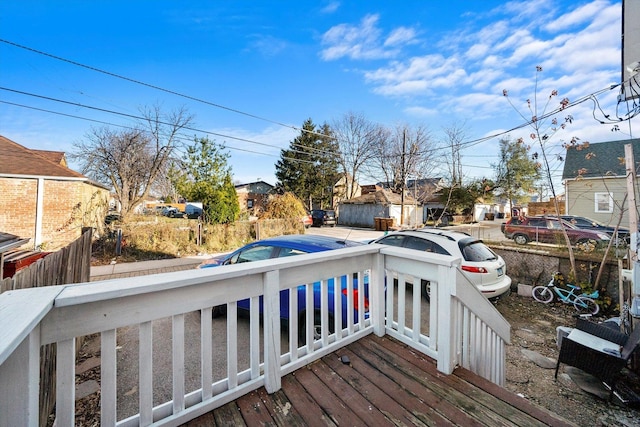 wooden deck featuring a residential view and fence