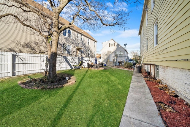 view of yard with fence and a residential view