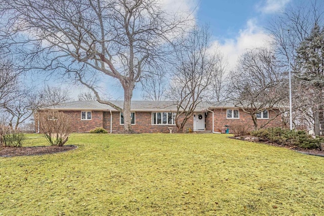 ranch-style home with a front lawn and brick siding