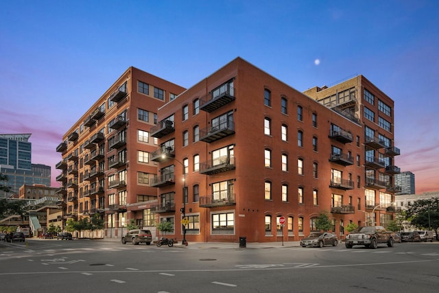 property at dusk with a view of city