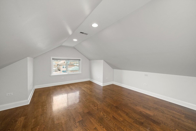 additional living space featuring recessed lighting, visible vents, vaulted ceiling, wood finished floors, and baseboards