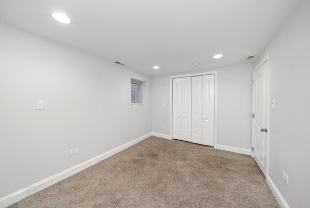 unfurnished bedroom featuring recessed lighting, carpet flooring, visible vents, and baseboards