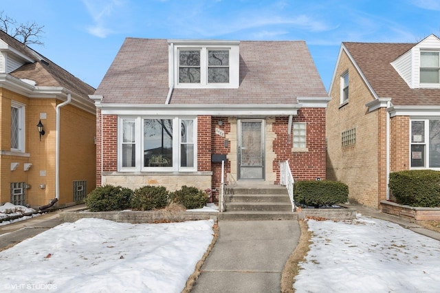 view of front of home with stone siding and brick siding