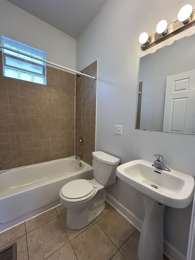 1234 W 49th Pl, Chicago, IL 60609 - full bathroom with visible vents, baseboards, toilet, shower / tub combination, and tile patterned floors