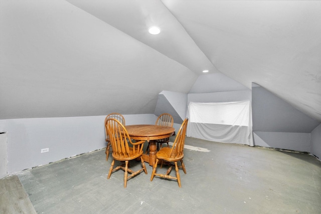 dining room featuring lofted ceiling and recessed lighting