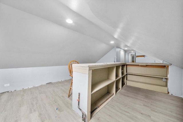 bonus room featuring vaulted ceiling, light wood finished floors, and recessed lighting