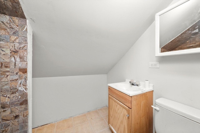 full bath featuring toilet, lofted ceiling, and vanity