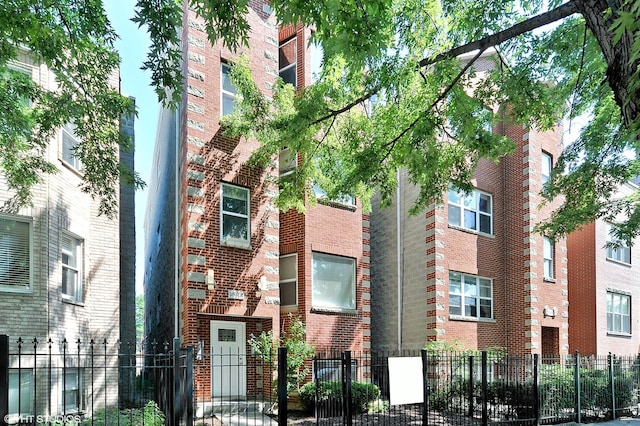 view of building exterior with fence