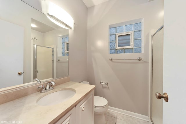 full bathroom with toilet, vanity, baseboards, a shower stall, and tile patterned floors