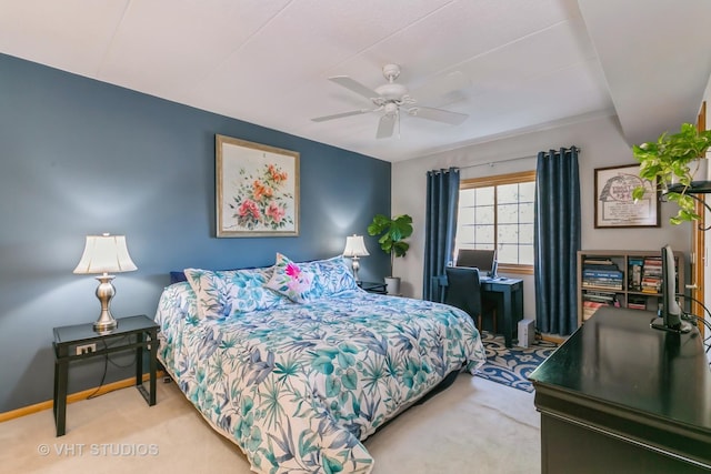 carpeted bedroom with baseboards and a ceiling fan