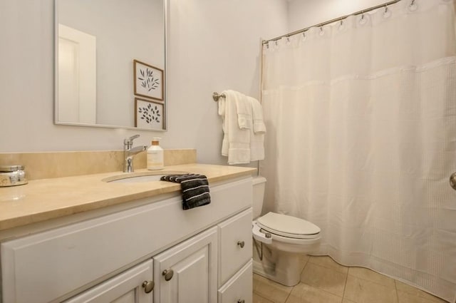 full bathroom featuring toilet, curtained shower, vanity, and tile patterned floors