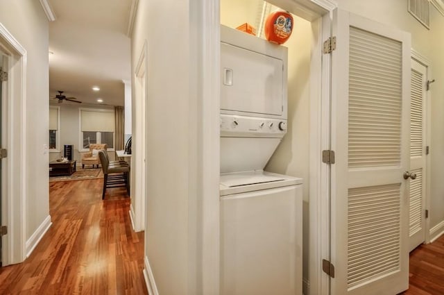 hall with baseboards, wood finished floors, and recessed lighting