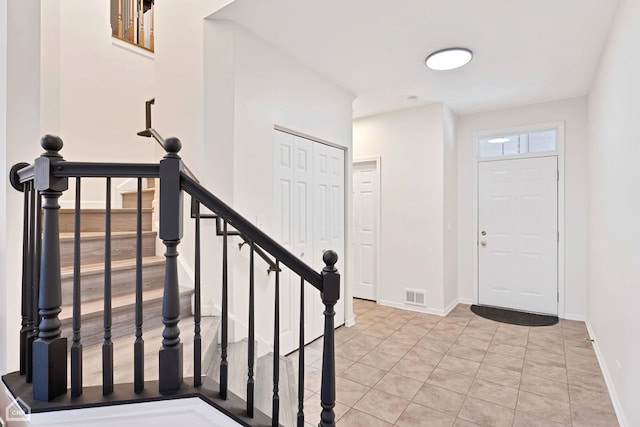 entryway with visible vents and baseboards