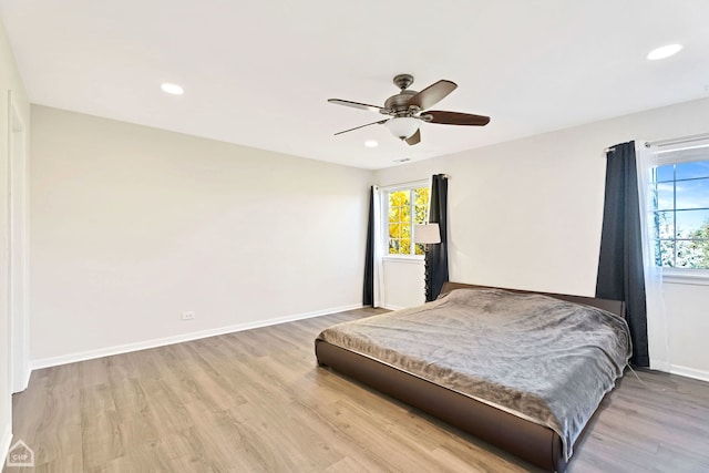 bedroom featuring recessed lighting, baseboards, wood finished floors, and ceiling fan