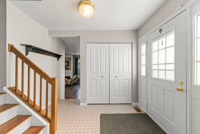 2031 Edinburgh Ln, Aurora, IL 60504 - entrance foyer with tile patterned floors and stairs