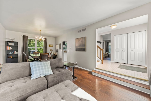 2031 Edinburgh Ln, Aurora, IL 60504 - living room with dark wood-type flooring, a chandelier, and stairs