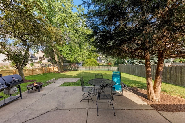 2031 Edinburgh Ln, Aurora, IL 60504 - fenced backyard featuring a fire pit, a patio area, a grill, and outdoor dining space