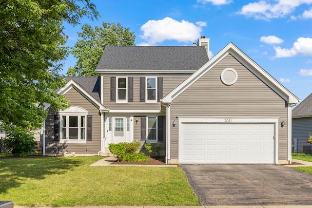 2031 Edinburgh Ln, Aurora, IL 60504 - view of front facade with asphalt driveway, a chimney, a front yard, and an attached garage