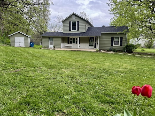 back of property with an outdoor structure, a shingled roof, a lawn, and a shed
