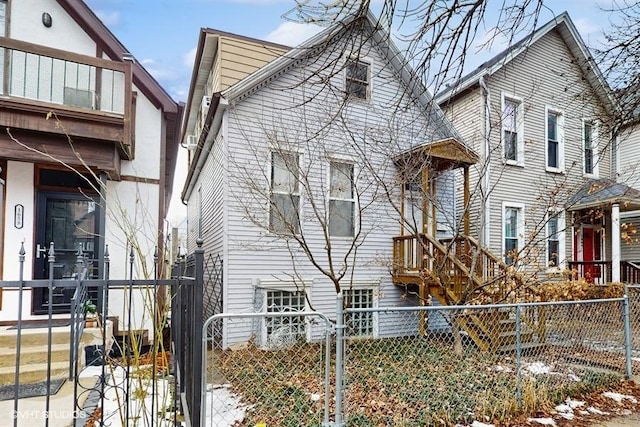 view of front of house featuring a fenced front yard and a gate