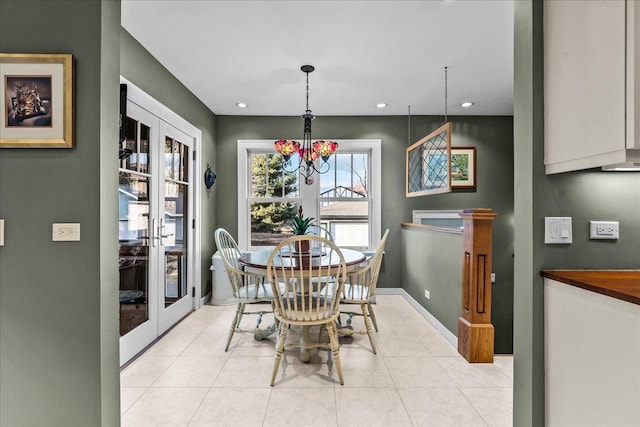 dining space with light tile patterned floors, french doors, baseboards, and recessed lighting