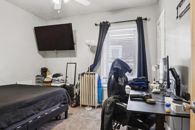 bedroom with carpet flooring, a ceiling fan, and radiator