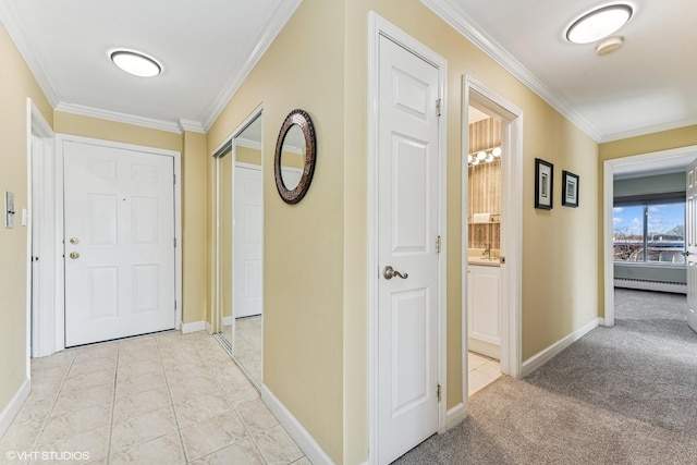 hall featuring light tile patterned floors, baseboards, ornamental molding, and baseboard heating