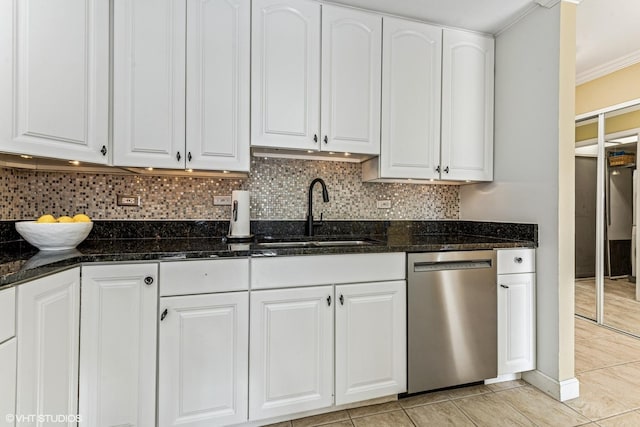 kitchen featuring a sink, white cabinetry, backsplash, and dishwasher