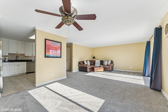 living area with light carpet, ceiling fan, ornamental molding, and baseboards